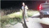  ?? SOUTH FLORIDA WATER MANAGEMENT DISTRICT ?? Kyle Penniston, of Homestead, captured a 17-foot, 5-inch, 120-pound female Burmese python while hunting in Miami-Dade County.