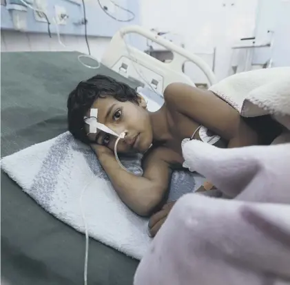  ??  ?? 0 A child with diphtheria receives life-saving treatment in Yemen’s capital Sanaa; others are not so fortunate.