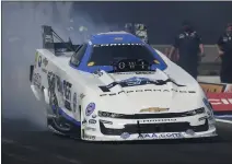  ?? MICHAEL ALLIO — NHRA VIA AP ?? Funny Car legend John Force, at 72, picks up back-to-back four-wide wins in the final round Sunday at zMAX Dragway in Concord, N.C.