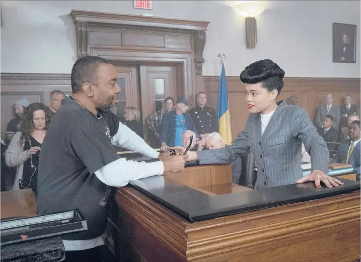  ?? TAKASHI SEIDA/HULU ?? Director Lee Daniels interacts with Andra Day, who portrays the title singer, on the set of“The United States vs. Billie Holiday.”