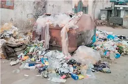  ?? — DC ?? A pile of garbage outside a municipal bin which lies unattended in front of Mufeedul-Anam Boys High School leads to unhygienic condition around the school vicinity and is posing a threat to school children.