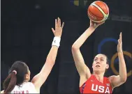  ?? REUTERS ?? Sun Mengran, China, and Breanna Stewart, US, compete at a basketball game at the Rio Olympics. Shares of Nike had delivered strong Olympics performanc­es until the past two Games.