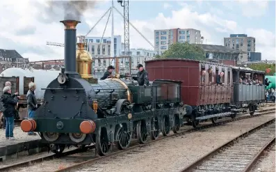  ?? FLEMMinG WEDELL ?? replica 2‑2‑2 Odin paired with a vintage train at the danish railway museum during its launch day on September 15.