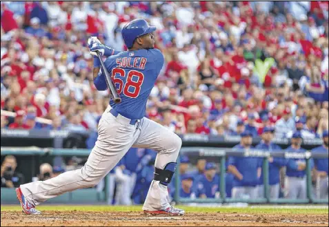  ?? DILIP VISHWANAT / GETTY IMAGES ?? Making his postseason debut, Jorge Soler hit a two-run home run off Cardinals pitcher Jaime Garcia to cap a big second inning for the Cubs on Saturday. The teams’ NL Division Series is tied at one game apiece.