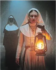  ??  ?? Owen Vaccaro, above, plays an orphaned misfit who comes to live in a mysterious houe in "The House With A Clock in Its Walls."Taissa Farmiga walks the creepy cloisters in a scene from "The Nun."