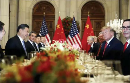  ?? PABLO MARTINEZ MONSIVAIS — THE ASSOCIATED PRESS FILE ?? U.S. President Donald Trump, second right, and China’s President Xi Jinping, second left, attend their bilateral meeting at the G20 Summit in Buenos Aires, Argentina. A U.S.-Chinese cease fire on tariffs gives jittery companies a respite but does little to resolve a war over Beijing’s technology ambitions that threatens to chill global economic growth.