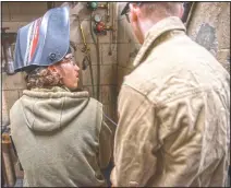  ?? (The News & Advance/Kendall Warner) ?? Johnathan Graham (left) talks with classmate Elijah Grishaw while preparing to start work on their pieces for the Central Virginia Welding Wars at Amherst County High School in Amherst, Va.