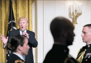  ??  ?? President Donald Trump speaks at a reception for senators and their spouses Tuesday in the East Room of the White House.