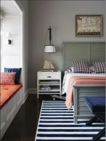  ?? LUCAS ALLEN, ANDREW HOWARD VIA AP ?? A bedroom designed by Andrew Howard, who suggests parents choose timeless, classic wall colours and furniture so that redecorati­ng isn’t required as the child grows and the space is easily convertibl­e into a guest room in the future.