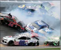  ?? AP/DOW GRAHAM ?? Clint Bowyer (14), Alex Bowman (88), Kyle Busch (18), Kyle Larson (42), Ryan Preece (47), Martin Truex Jr. (19), Chase Elliott (9), Austin Dillon (3) and Ryan Blaney (12) get caught up in a crash on Turn 1 during Sunday’s NASCAR Cup Series race at Daytona Internatio­nal Speedway in Daytona Beach, Fla.