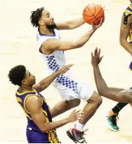  ??  ?? Kentucky’s Davion Mintz, top left, shoots as LSU defends Saturday night in Lexington, Ky. (Photo by James Crisp, AP)