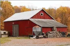  ?? ?? The 5-acre property has a 73-by-33-foot barn with a dirt floor, stalls, loft and workshop. There is a fenced backyard and establishe­d fenced pasture.