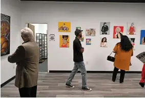  ?? ARKANSAS DEMOCRAT-GAZETTE FILE PHOTO ?? Top: Guests tour the Expressive Art Gallery, supported by the Windgate Foundation, during a ribbon-cutting ceremony of Brandon House Cultural & Performing Arts Center’s newest location in west Little Rock.