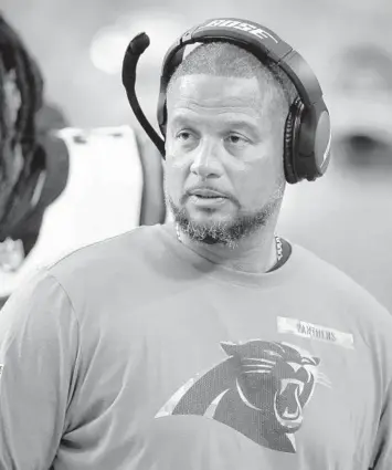  ?? RALPH FRESO/AP ?? Panthers defensive run game coordinato­r Al Holcomb stands on the sideline during a game on Nov. 14.