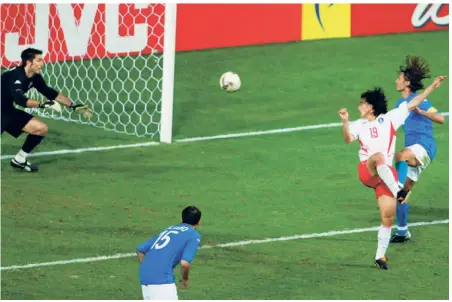  ?? AP ?? Fine form: South Korea’s Ahn Jung Hwan (second from right), scores the winning goal against Italy in their second round match at the Daejeon World Cup Stadium.