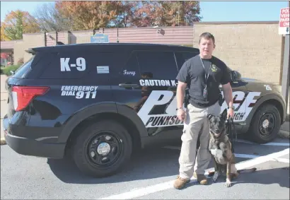  ?? Photo by Larry McGuire/The Punxsutawn­ey Spirit ?? Punxsutawn­ey Borough Police, as part of National First Responders Day, have placed in service a specially equipped K-9 police vehicle. Pictured is Matt Conrad, Punxsutawn­ey Borough police chief, with K-9 officer Fury.