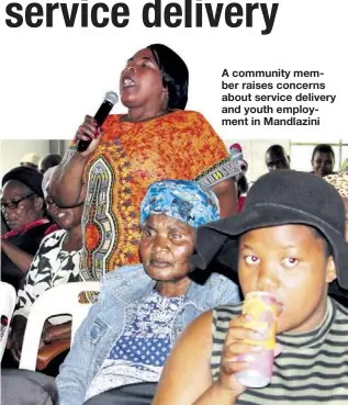  ??  ?? A community member raises concerns about service delivery and youth employment in Mandlazini