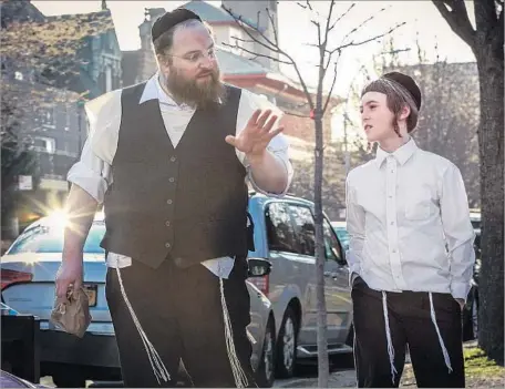  ?? Wehkamp Photograph­y / A24 ?? IT’S LIKE THIS: Menashe (Menashe Lustig, left) instructs Rieven (Ruben Niborski) in film set in ultra-orthodox Jewish community.