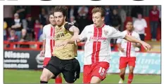  ??  ?? TUSSLE: Leyton Orient’s Romain Vincelot with Luke Freeman