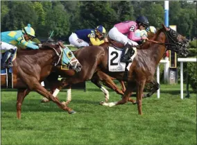  ?? NYRA ?? Glorious Empire (background) with Julien Leparoux aboard with Joel Rosario aboard Channel Maker (2) on the outside in a dead heat in last year’s Bowling Green Stakes (G2) at Saratoga Race Course.