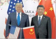  ?? SUSAN WALSH / AP ?? President Donald Trump, left, poses for a photo with Chinese President Xi Jinping during a meeting on the sidelines of the G-20 summit in Osaka, Japan, on June 29.