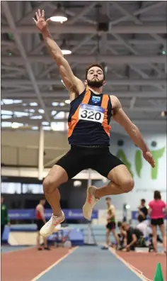  ??  ?? Slí Cualann’s Ben Browne Roche competing in the long jump event.