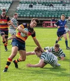  ??  ?? Lansdowne’s James Kenny gets away from Mark Myler.