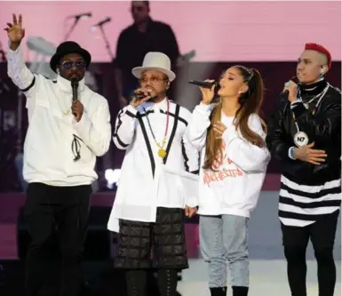  ?? GETTY IMAGES/DAVE HOGAN FOR ONE LOVE MANCHESTER ?? From left, will.i.am, apl.de.ap, Ariana Grande and Taboo perform at the One Love Manchester concert. "What if there were multi-platinum Muslim artists on the stage creating a counter narrative of Islam?" Nadir Shirazi and Sachin Maharaj write.