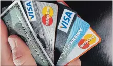  ?? ELISE AMENDOLA THE ASSOCIATED PRESS ?? Only about half of Canadians pay off their credit cards each month.
