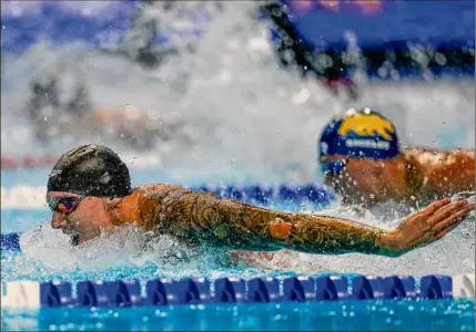  ?? Jeff Roberson / Associated Press ?? Caeleb Dressel races in the 100-meter butterfly at the U.S. Olympic trials Saturday. The 24-year-old is hoping to join Michael Phelps, Mark Spitz and Matt Biondi as the only swimmers to win seven medals at the Olympics.