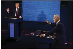  ?? (AP/Morry Gash) ?? In this photo from Sept. 29, 2020, President Donald Trump and Democratic presidenti­al candidate Joe Biden exchange points during their first presidenti­al debate at Case Western University and Cleveland Clinic in Cleveland.