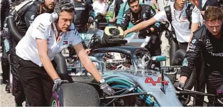  ?? AFP PIC ?? Mercedes AMG Petronas driver Lewis Hamilton is pushed onto the grid for the start of the United States Grand Prix on Sunday.