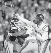  ?? Rogelio V. Solis / Associated Press ?? Mississipp­i quarterbac­k Jordan Ta’amu passed for two touchdowns in the Rebels’ Egg Bowl upset of No. 14 Mississipp­i State at Starkville, Miss.