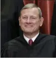  ?? J. SCOTT APPLEWHITE - ASSOCIATED PRESS ?? In this 2018 file photo, Chief Justice of the United States John G. Roberts sits with fellow Supreme Court justices for a group portrait at the Supreme Court Building in Washington.