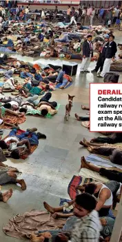  ?? AP ?? DERAILED?
Candidates for a railway recruitmen­t exam spend the night at the Allahabad railway station