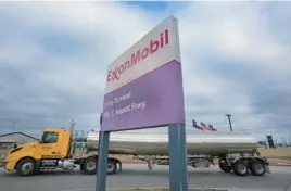  ?? LM OTERO/AP ?? A tanker pulls into an ExxonMobil fuel storage and distributi­on facility last month in Irving, Texas. Exxon Mobil posted a record $55.7 billion in annual net income in 2022.