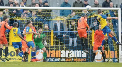  ?? PICTURES: TGSPHOTOS ?? AT THE DOUBLE: St Albans’ Sam Merson climbs high to head in his second