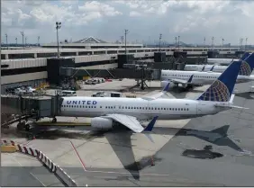  ?? (AP) ?? United Airlines planes sit parked July 1 at Newark Liberty Internatio­nal Airport in Newark, N.J. The company said it lost $1.63 billion in the second quarter.