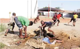  ??  ?? Young boys cool off in a pool of water at a leaking valve left open by council workers in the Granitesid­e industrial area, Harare, yesterday. All swimming pools in the capital city’s high density areas are closed due to the deadly Covid–19 pandemic. – Picture: Kudakwashe Hunda