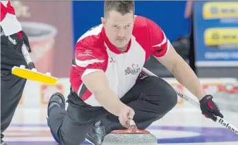  ?? ANDREW VAUGHAN/THE CANADIAN PRESS ?? Ben Hebert and the rest of Kevin Koe’s Team Canada rink will begin play at the Pyeongchan­g Winter Olympics at 6:05 p.m. Saskatchew­an time Tuesday against Italy.