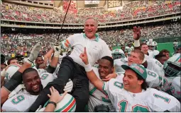  ?? GEORGE WIDMAN — THE ASSOCIATED PRESS ?? Members of the Miami Dolphins carry coach Don Shula off the field at Veterans Stadium on Nov. 14, 1993, after Shula’s 325th career win as a coach. The quarterbac­k of the Dolphins that day was current Eagles coach Doug Pederson. Shula died Monday at age 90.