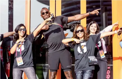  ?? ?? ↑
Jamaican lightning Usain Bolt poses with fans during a family race to raise funds for a charity at the Expo 2020 Dubai on Saturday.