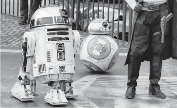  ?? JOE BURBANK TNS file ?? Droids R2-D2 and BB-8 at the entrance of the Star Wars: Galaxy's Edge attraction in Lake Buena Vista in 2019. David Proudfoot of Kissimmee is being accused of stealing and tampering with Disney resort property, including an R2-D2 statue.