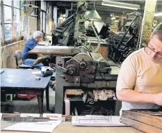  ??  ?? BELOW RIGHT A man works on a Linotype machine, which creates letters in lead.