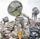  ?? ADAM DEAN/THE NEW YORK TIMES ?? Trash pickers search for plastic in Indonesia.