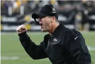  ?? The Associated Press ?? ■ Baltimore Ravens head coach John Harbaugh celebrates after tight end Mark Andrews made a catch near the goal line against the Pittsburgh Steelers during the first half on Dec. 5 in Pittsburgh.