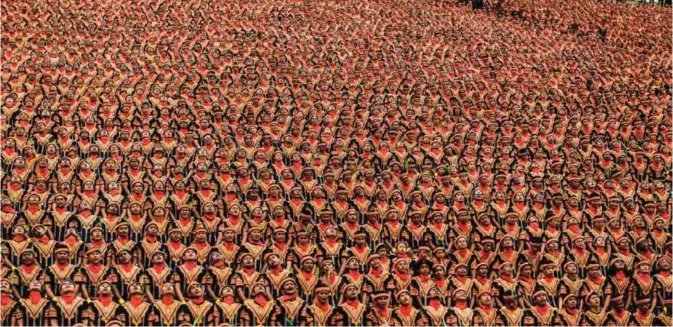  ?? — AFP photos ?? Men take part in a rehearsal of a mass traditiona­l Saman dance performanc­e in the Gayo Lues highland district in Aceh on Indonesia's Sumatra island on Saturday.