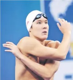  ??  ?? South Korea’s Park Tae Hwan warming up prior to competing in the final of the men’s 200metre freestyle swimming event in the FINA World Championsh­ips at the indoor stadium of the Oriental Sports Center in Shanghai, in this July 26, 2011 file photo. —...