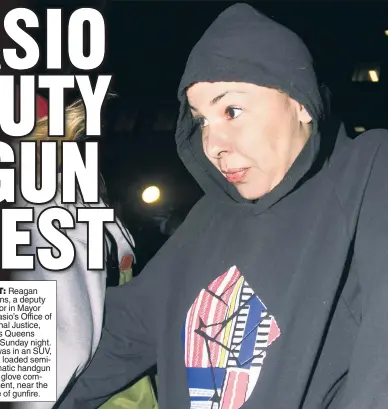  ??  ?? HEAT: Reagan Stevens, a deputy director in Mayor de Blasio’s Office of Criminal Justice, leaves Queens court Sunday night. She was in an SUV, with a loaded semiautoma­tic handgun in the glove compartmen­t, near the scene of gunfire.