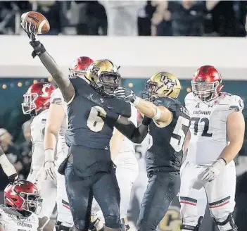  ?? STEPHEN M. DOWELL/ORLANDO SENTINEL ?? UCF defensive lineman Brendon Hayes celebrates after recovering a fumble during the game against Cincinnati at Spectrum Stadium in Orlando last season.